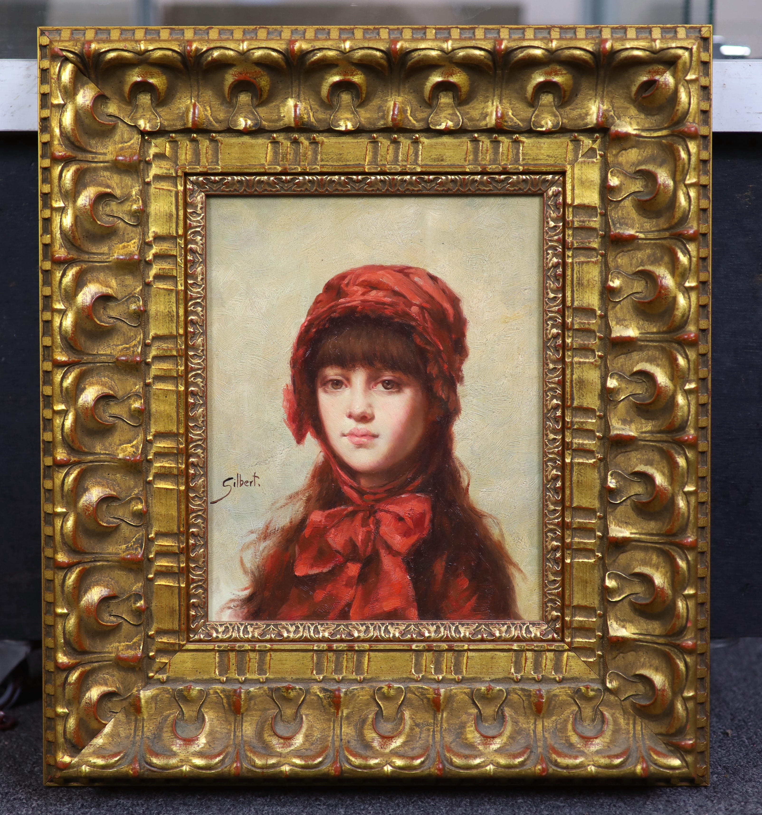 Gilbert, oil, possibly an overpainted print on board, Portrait of a girl wearing a bonnet, signed, 24 x 19cm